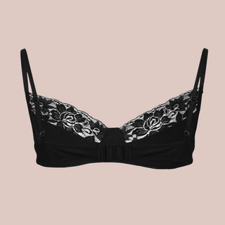 The black satin bra close up, you can see the black colour, half cup lace and thin adjustable straps.