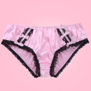 Shown unworn, Adult knickers for men, sissy, lgbt, unisex. Made in baby pink with black lace detailing to the legs and panels on each side. There are also matching wine satin bows prettily applied.