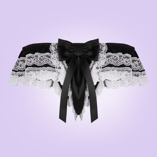 The rear view of the satin and lace tanga panties. You can see the large bow at the rear and the decorative lace edging.