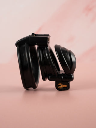 Another side on view of the chastity cage. This shows a clearer view of the lock on the bottom of the cage.