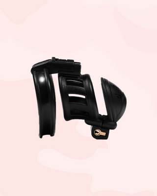 Showing the small design of the slaver, that comes in 3 different sizes: micro, small and standard double lock cock cages. Made from black resin, with Slaver imprinted on the head.