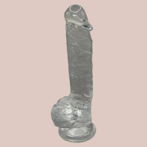 Showing the silicone dildo from House Of Chastity full length,the veining to the shaft and large glans can be seen.