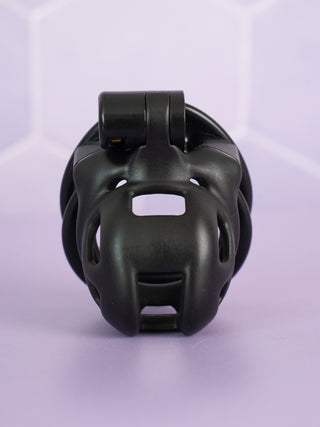 The black Super Mini Cobra Chastity Cage is shown from the front view, you can see the cut out design to allow for airflow, urination and cleaning.