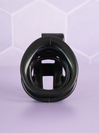 A rear view of the Super Mini Cobra chastity device, you can see through the base ring and into the cage.