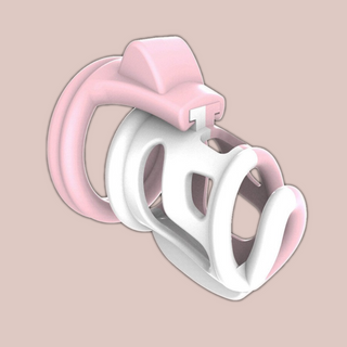 The fifi is a half pink and half white chastity cage that has a connecting pink base ring. The two tone style of the chastity deviceis shown in this picture.