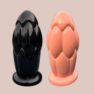 The Ballistic Bubble Anal Plug shown here in both colours available, black on the left and flesh pink on the right.