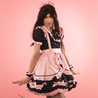 The Bowtiful Maid Dress shown in all its frilly glory. The black and pink colouring is complemented with our pink Swing Style Petticoat.