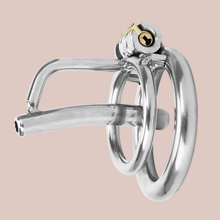 The Clink chastity cage with fixed urethral tube is shown from a side view. You can see the base ring and integral lock are fixed in place.