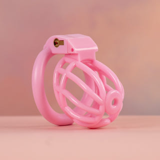 A close up of the black Cobra Prince Albert, you can see how the piercing can be used with the chastity cae in the front of the chastity cage.