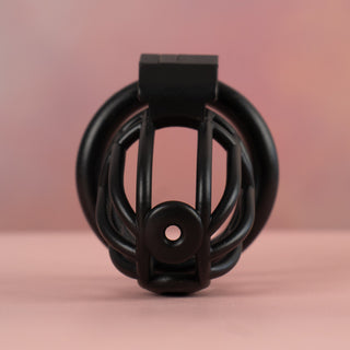 A close up image of the black Cobra Prince Albert, you can see the two specifically placed holes to allow for the piercing.