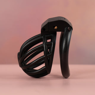 A side view of the chastity cage, you can see the slight curve to the base ring.