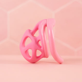 A side view of the chastity cage with the angled base ring fitted.