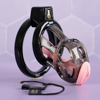 A side view of the black chastity cage, you can see that the urethral tube has been inserted into the device.