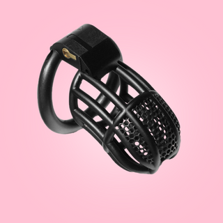 The Black Detained Chastity Cage, you can see the lined body with the mesh affect to the top. The chastity cage is fitted to its base ring and the integral lock is in place.