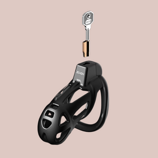 The Jeusn chastity cage shown assembled with the integral lock being prepared to insert in the lock along with a key.