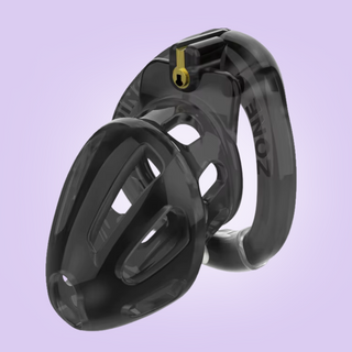 A front view of the Kidding Zone Chastity Device, shown is a length view of the cage, attached base ring and integral lock in place.