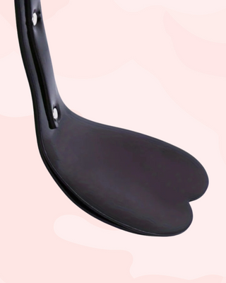 Showing the angled head of the paddle, it is to show that it will deliver a soft but effective spanking.