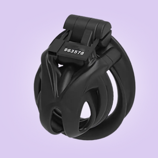 An angled view of the Nano sized chastity cage, you can also see the magic locker in place and a numbered tag.