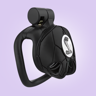 The nano chastity cage is shown here fully assembled with a white python logo to the centre of the cage face.