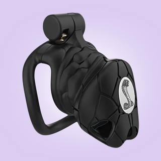 The chastity cage is shown here with the logo on the cage face.