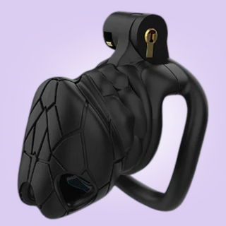 The chastity cage is shown full assembled with the integral lock fixed in place. You can see the cage face and body is patterned like a python.