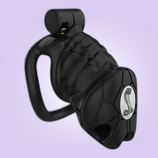 The small sized chastity cage has an ingrained pattern to the face and head, and this cage shows the logo on the face.