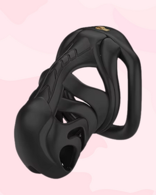 An angled profile of the fully assembled chastity cage, the flat base ring is fitted to the cage and the mini integral lock is fixed in place.