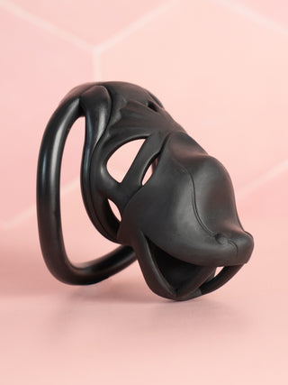 A side profile of The Serpent Sentry cock cage, the cage is fully assembled with its flat base ring and integral lock fitted.