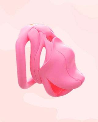 A side profile of the pink Serpent Sentry cock cage, it is shown fully assembled with its base ring and integral lock fitted in place.