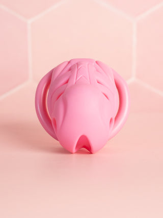 A front on view of the Serpents Hold Cock Cage, the open end is designed for air flow, urination and cleaning.