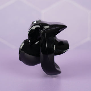 A side view of the HT V5 Nub chastity cage, shown here in black, you can see the angled base ring.