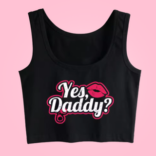 The crop top is lying flat with the printed Yes, Daddy? logo print clear to see.