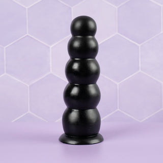 The Amative with its 5 insertable beads, it is stood on its suction base.