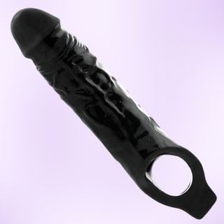 A full length view of the black penis sleeve 