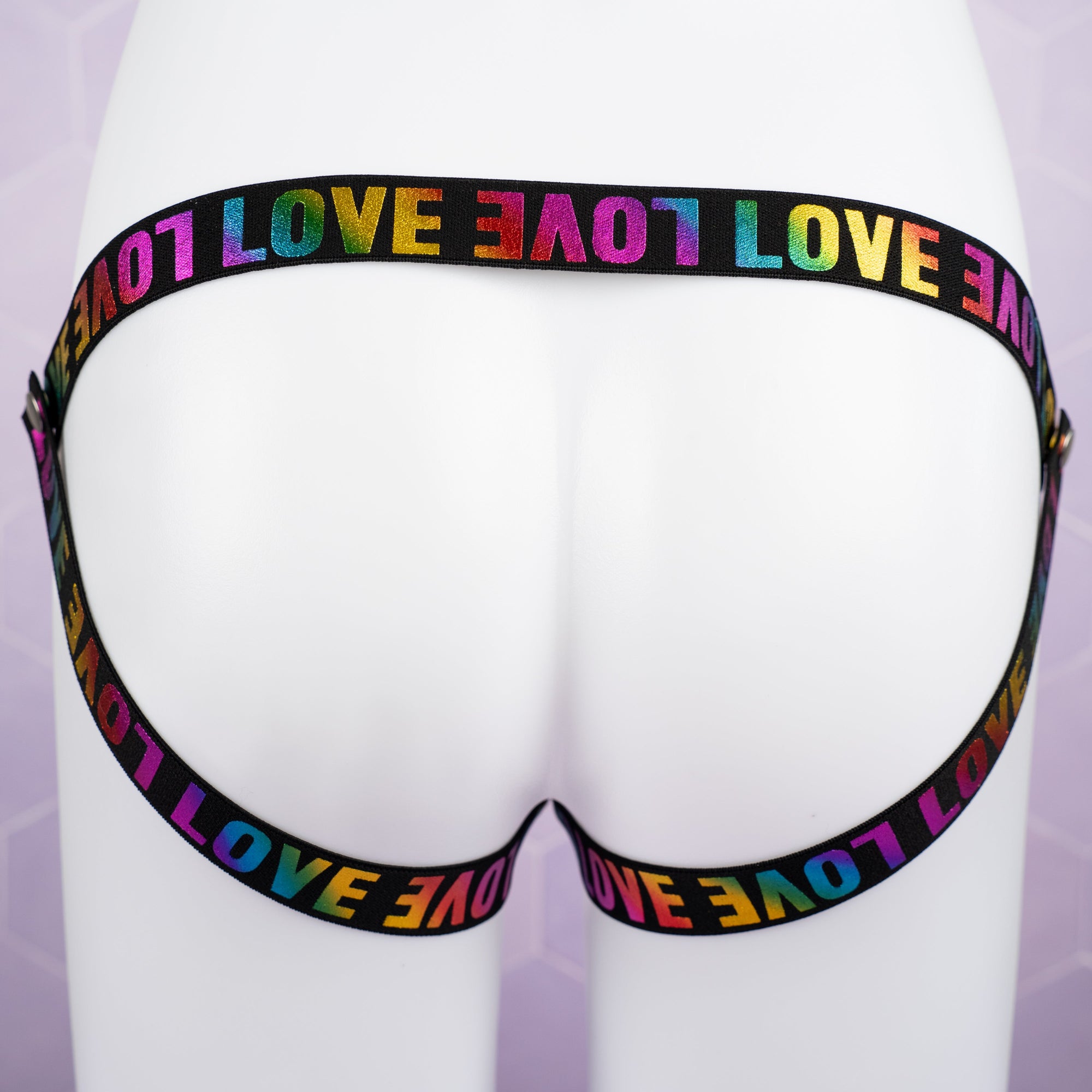 The jock strap style fit of the 3 way restraining chastity belt is shown here, you can see the LOVE print clearly.