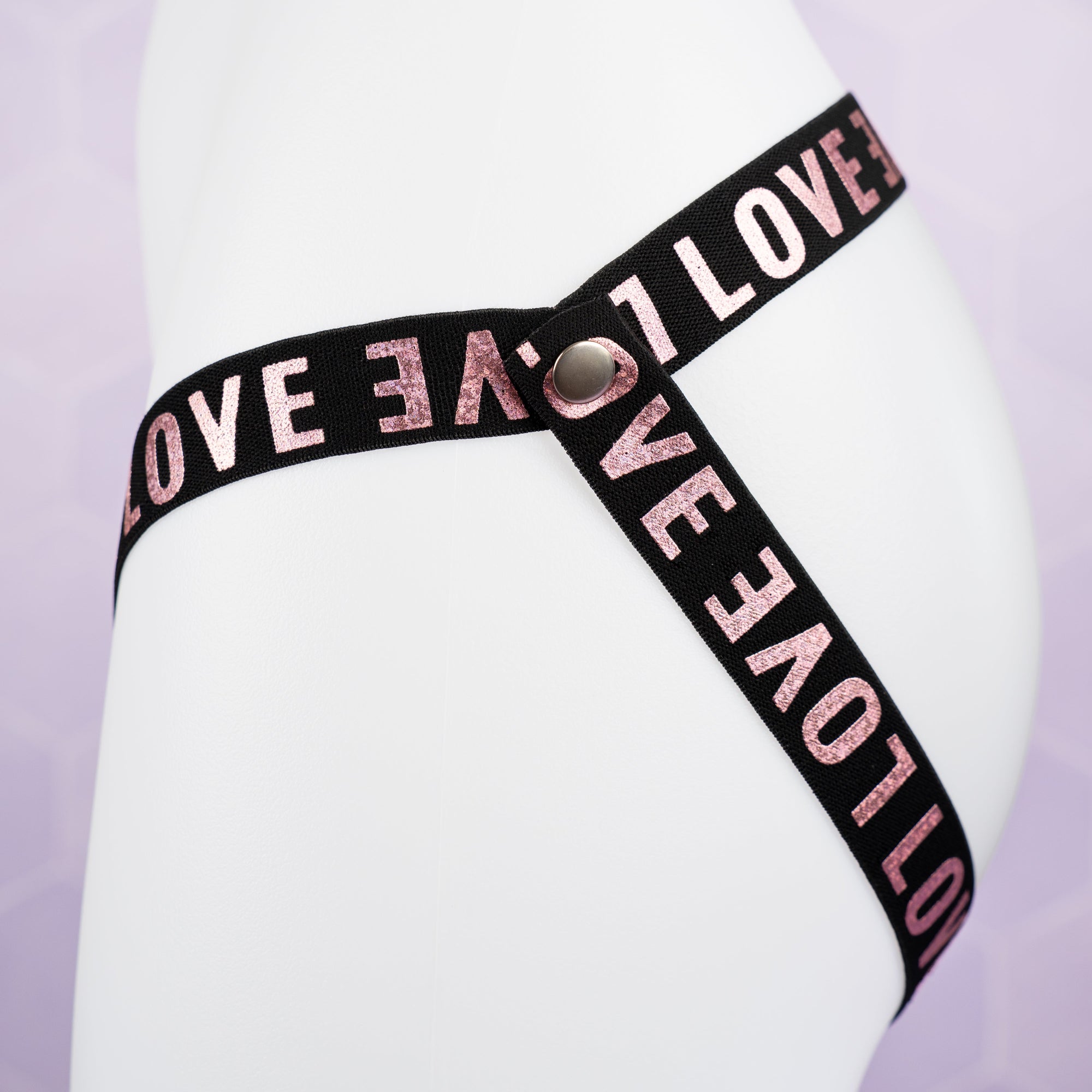 A side view of the 3 Way Restraining, you can see the popper fixing and LOVE lettering.