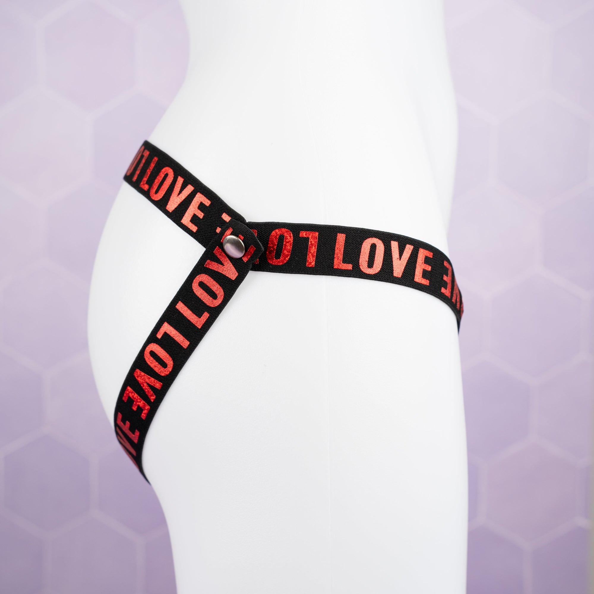 A side view of the 3 Way Restraining, you can see the popper fixing and LOVE lettering.