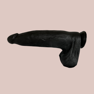 A side view of the super size dildo. You can see how the suction base can be attached to a hard surface.