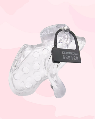 The transparent Air 1 chstity cage shown fully  assembled, it is shown here with the pin and individually numbered tags locking it.
