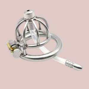 A male stainless steel nub sized chastity cage with umbrella head design with integral lock that fixes the cage and base ring together. This product also comes with a removable urethral insert.