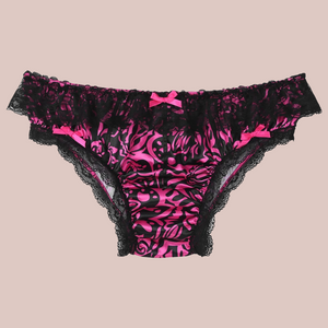 The front view of the wild pink satin bow knot panties with black lace edging.