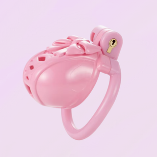 A side view of the chastity cag shown fully assembled on a soft purple background