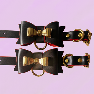 A close up of the bows on the ankle cuffs, the o-rings hang from the centre of the bow