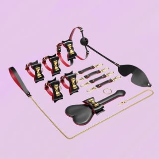 the full set of the Bow & Bind Bondage kit shown on a purple background