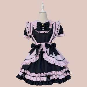 A front view of this gorgeous maids dress, you can see the frilled detailing to the dress, the apron and removable large bows.