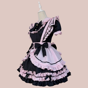 An angled view of the Bowtiful Maid Dress, you can see the flounced detailing, the puffed sleeves and bows.