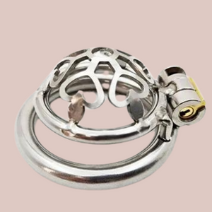 A view of the Cage Of Hearts nub chastity cage on its back, you can see the fanned heart fretwork design .