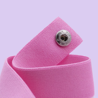 A close up of the elasticated material and poppers on the chastity belt with front support.