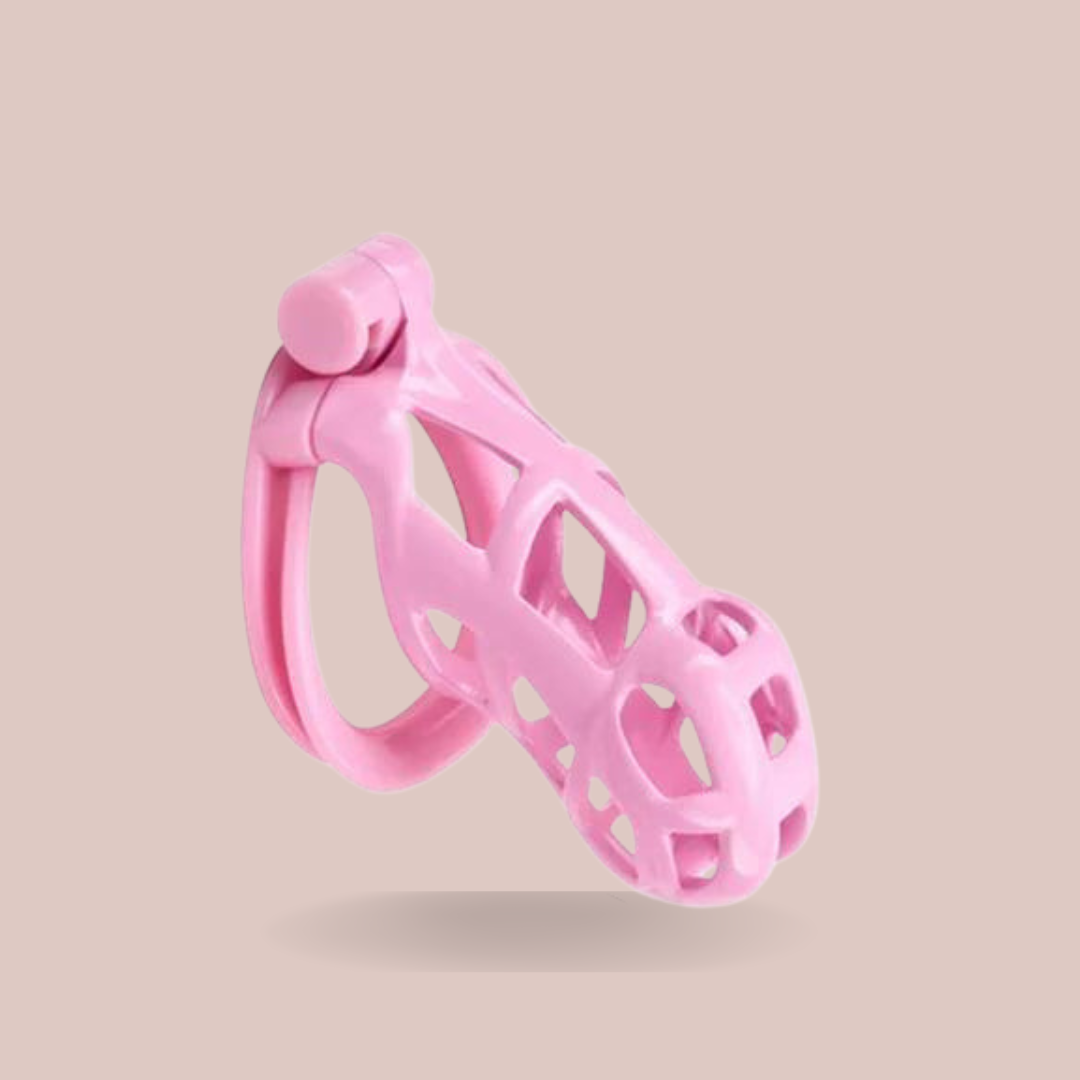 The pink Standard Cobra Double Cuff chastity cage from House Of Chastity