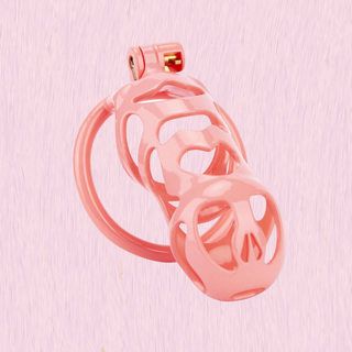 The Cobra Love Maxi chastity cage on a pink background.